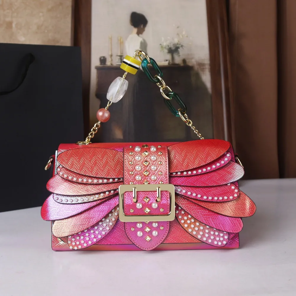 2026 pearl colorful rivet wing bag with leather trendy bag chain gradient handbag dinner bag dragonfly shoulder bag
2026 pearl colorful rivet wing bag with leather trendy bag chain gradient handbag dinner bag dragonfly shoulder bag