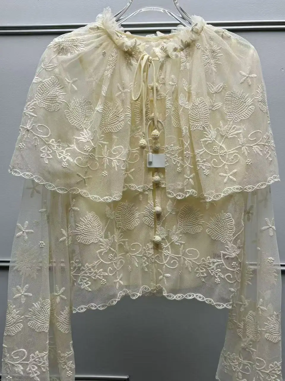Elegant Embroidered Lace Shoulder Wrap Shirt with Bell Sleeves for Women Spring Summer New Style Casual Loose Fit Long Sleeve
Elegant Embroidered Lace Shoulder Wrap Shirt with Bell Sleeves for Women Spring Summer New Style Casual Loose Fit Long Sleeve