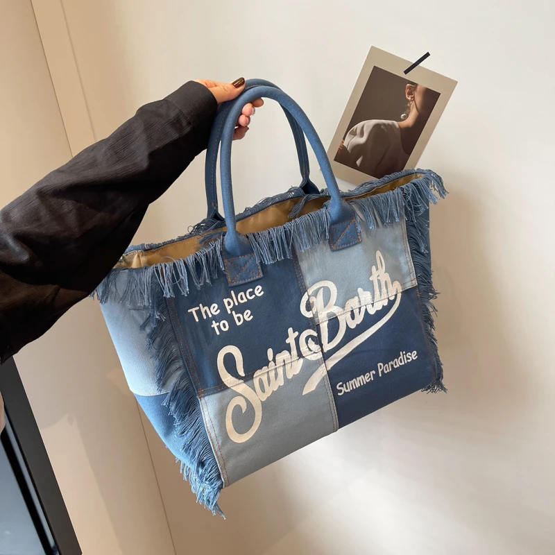 Korean letters tassel canvas bag large capacity bag bag simple commuter student to single shoulder Tote bag
Korean letters tassel canvas bag large capacity bag bag simple commuter student to single shoulder Tote bag