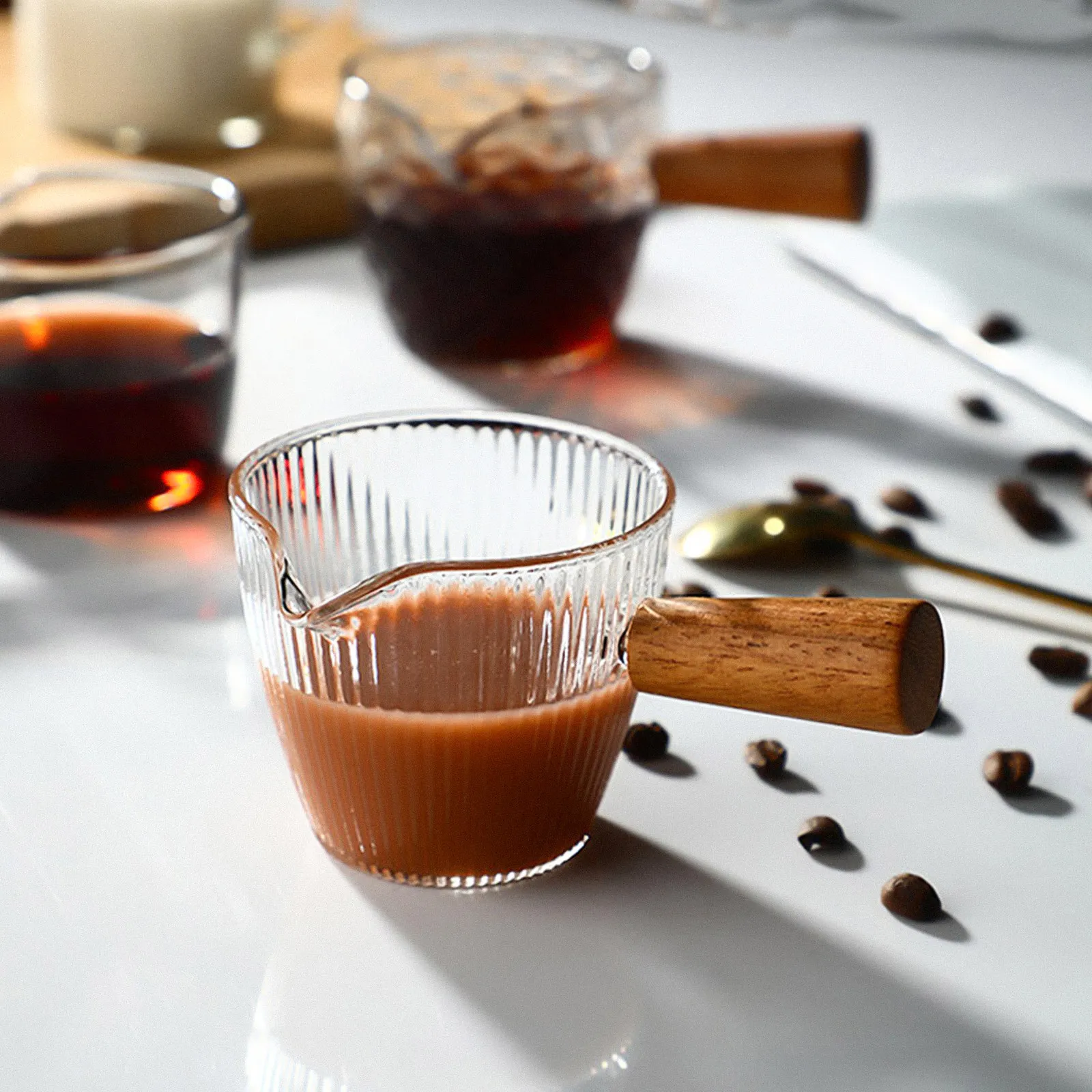 Transparent Hammered Glass Milk Pitcher with Solid Wood Handle Multi Purpose Creamer Pitcher for Coffee Milk Juice Ice Cream
Transparent Hammered Glass Milk Pitcher with Solid Wood Handle Multi Purpose Creamer Pitcher for Coffee Milk Juice Ice Cream