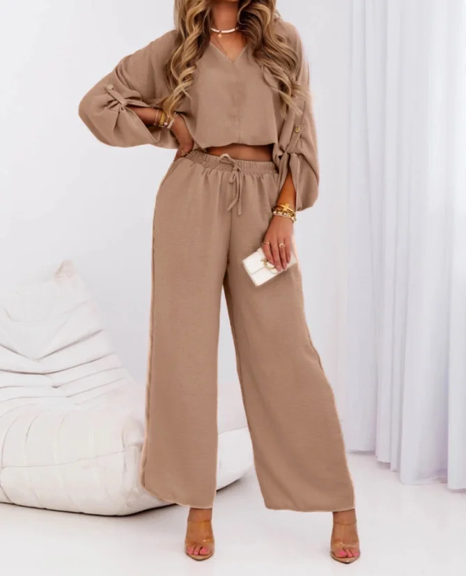 V-Neck Long Sleeved Button Top and High Waisted Casual Lace Up Wide Leg Pants Set for Women's Summer Elegant 2-Piece Set
V-Neck Long Sleeved Button Top and High Waisted Casual Lace Up Wide Leg Pants Set for Women's Summer Elegant 2-Piece Set