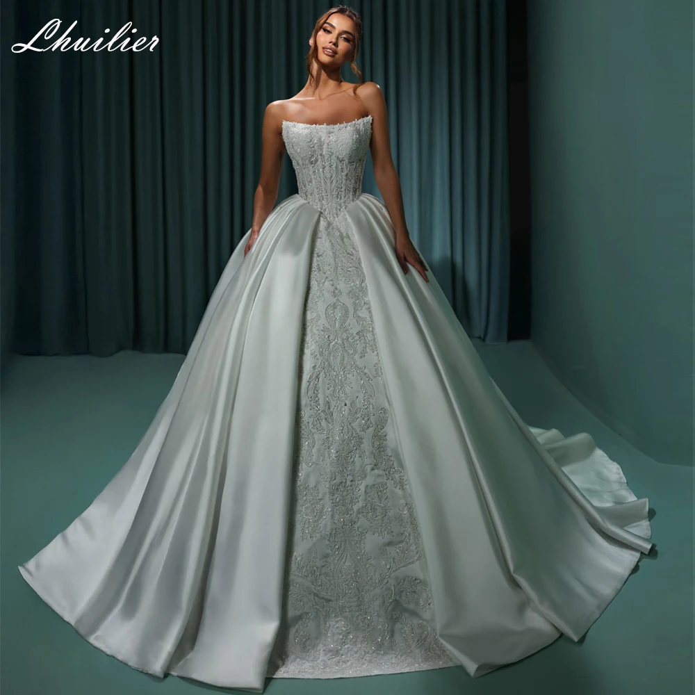 Lhuilier Customized A Line Strapless Satin Wedding Dresses Sleeveless Beaded Lace Bridal Gown with Court Train
Lhuilier Customized A Line Strapless Satin Wedding Dresses Sleeveless Beaded Lace Bridal Gown with Court Train