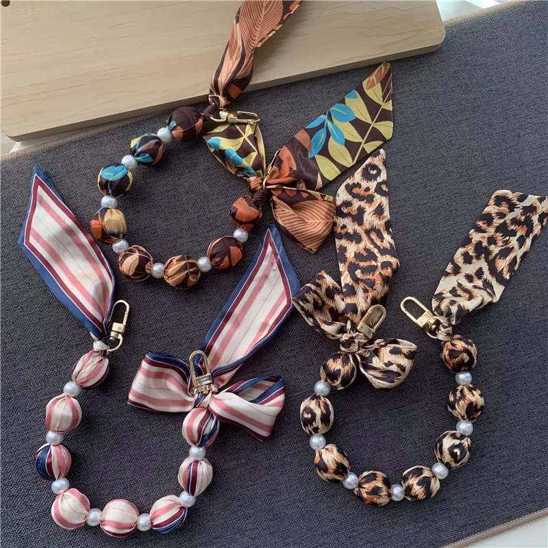 Beaded Mobile Phone Wrist Chain Lanyard Short Section Style Hundred With Silk Scarf Phone Anti-loss Chain Handheld Pendant
Beaded Mobile Phone Wrist Chain Lanyard Short Section Style Hundred With Silk Scarf Phone Anti-loss Chain Handheld Pendant