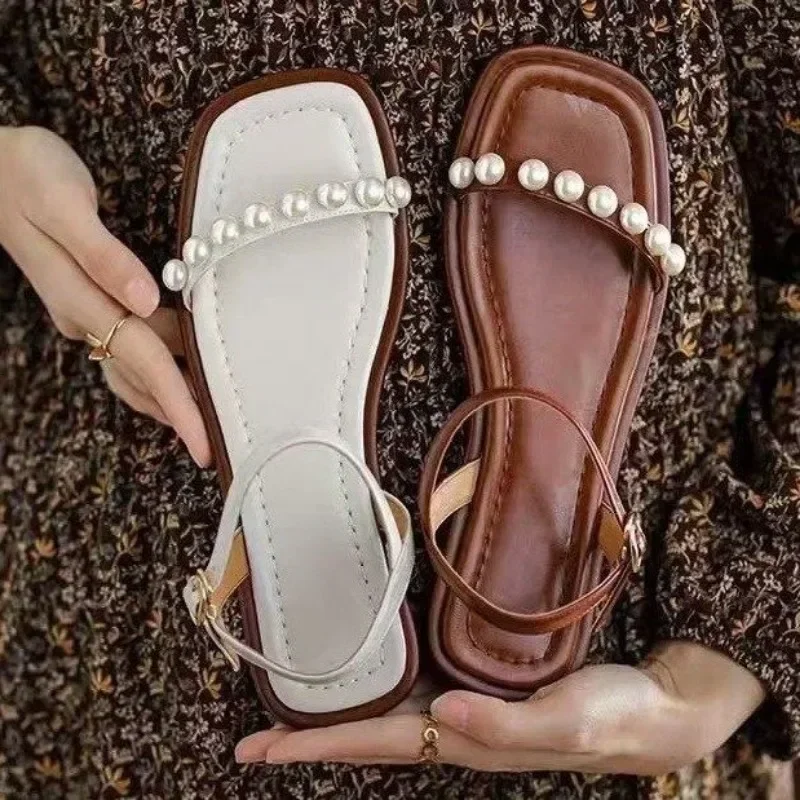 2025 Summer Women's sandals Women's comfortable flat sandals Fashion open-toed Roman sandals pearl one-line buckle
2025 Summer Women's sandals Women's comfortable flat sandals Fashion open-toed Roman sandals pearl one-line buckle