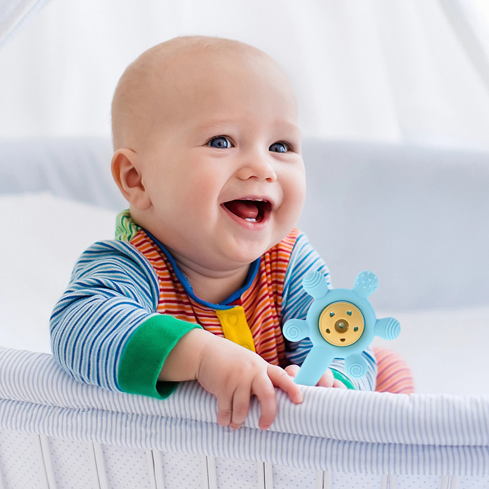 Infant Teething Rattle: Soft Silicone Ring for Babies - Multifunctional Teether with Rattle Sound, Ergonomic Design for Hand-Eye
Infant Teething Rattle: Soft Silicone Ring for Babies - Multifunctional Teether with Rattle Sound, Ergonomic Design for Hand-Eye