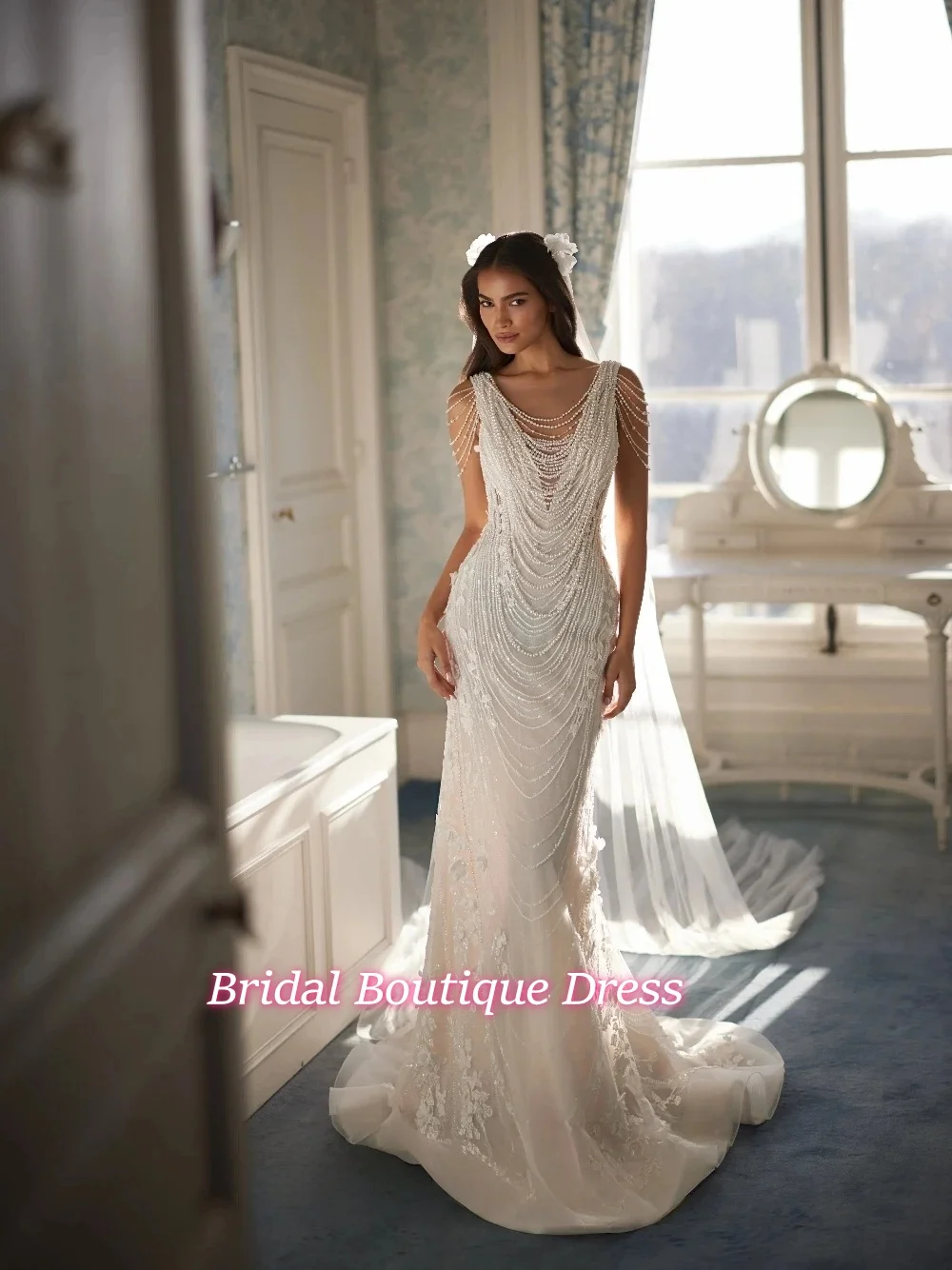 Exquisite Pearl Beaded Tassel Fringe Wedding Dress Glamorous Glitter Sleeveless Mermaid Floral Appliques Customized Bridal Gown
Exquisite Pearl Beaded Tassel Fringe Wedding Dress Glamorous Glitter Sleeveless Mermaid Floral Appliques Customized Bridal Gown