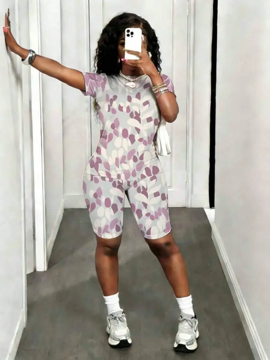 Womens Two-Piece Set With Abstract Leaf Print, Short Sleeve Top And Biker Shorts For Casual Wear
Womens Two-Piece Set With Abstract Leaf Print, Short Sleeve Top And Biker Shorts For Casual Wear