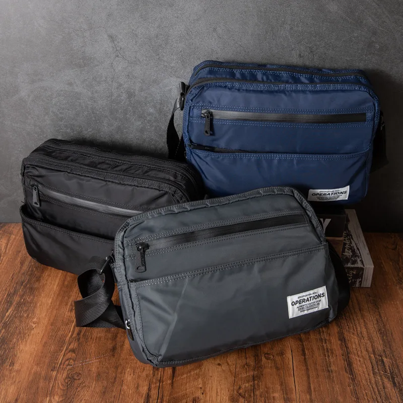 Operations Мужская сумка через плечо из ткани быка, повседневная сумка через плечо, сумка-мессенджер для молодых студентов, корейская сумка для отдыха Sle
Operations Мужская сумка через плечо из ткани быка, повседневная сумка через плечо, сумка-мессенджер для молодых студентов, корейская сумка для отдыха Sle