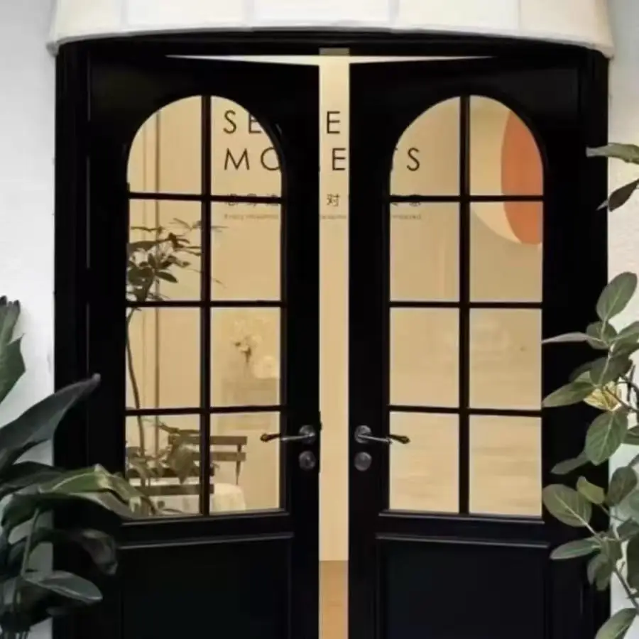 French retro curved door wrought iron glass casement door clothing store arched restaurant cafe arc door
French retro curved door wrought iron glass casement door clothing store arched restaurant cafe arc door