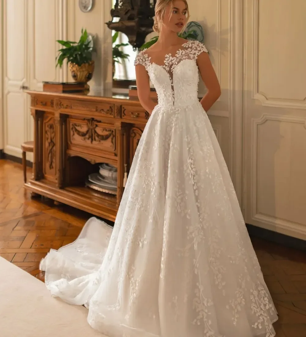 Elegant Wedding Dresse 2026 Sheer-Capelet Lace Appliques Buttons Back Tulle A-line Bridal Bride Gowns Robe De Mariage
Elegant Wedding Dresse 2026 Sheer-Capelet Lace Appliques Buttons Back Tulle A-line Bridal Bride Gowns Robe De Mariage
