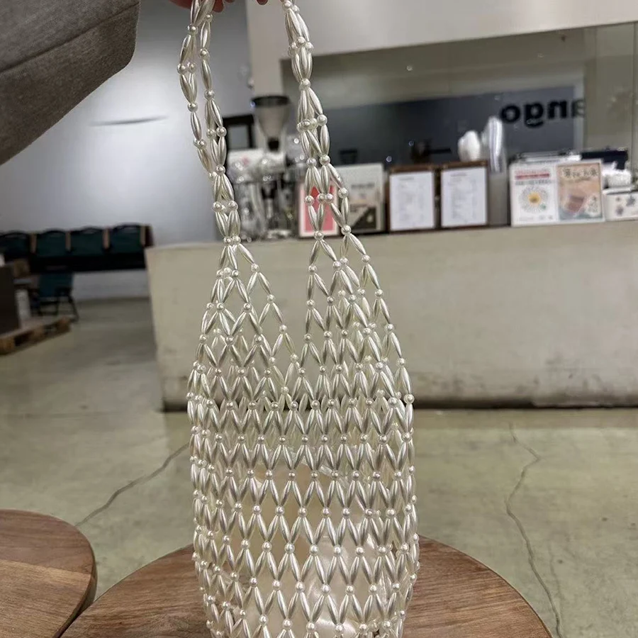 Women Woven hand bag summer hollow-out Artificial pearls tote bucket shoulder bag female Reticulate netted canvas beach handbags
Women Woven hand bag summer hollow-out Artificial pearls tote bucket shoulder bag female Reticulate netted canvas beach handbags