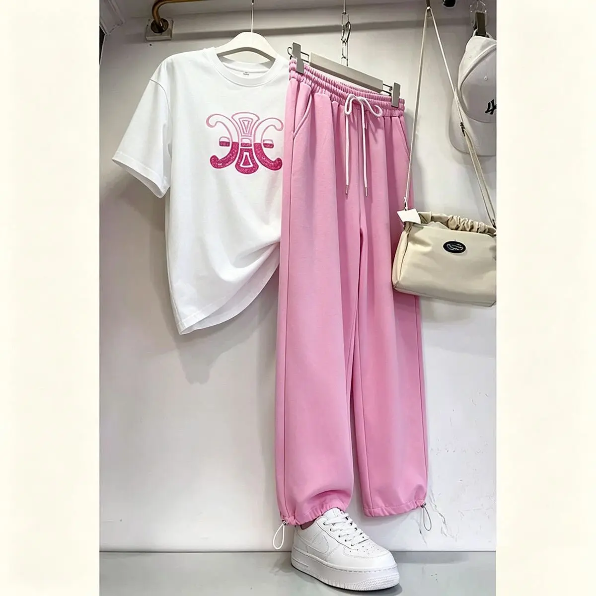 Summer Sporty Loose Women's Two-Piece Set Short Sleeve Fashionable Wide Leg Pants High Waist Long Pants Polyester Fiber
Summer Sporty Loose Women's Two-Piece Set Short Sleeve Fashionable Wide Leg Pants High Waist Long Pants Polyester Fiber