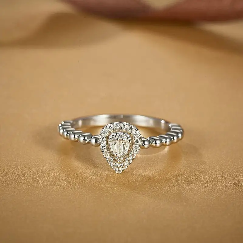 0.12 TCW Pear Cut Moissanite Halo Women's Engagement Ring 14K Solid White Gold
0.12 TCW Pear Cut Moissanite Halo Women's Engagement Ring 14K Solid White Gold