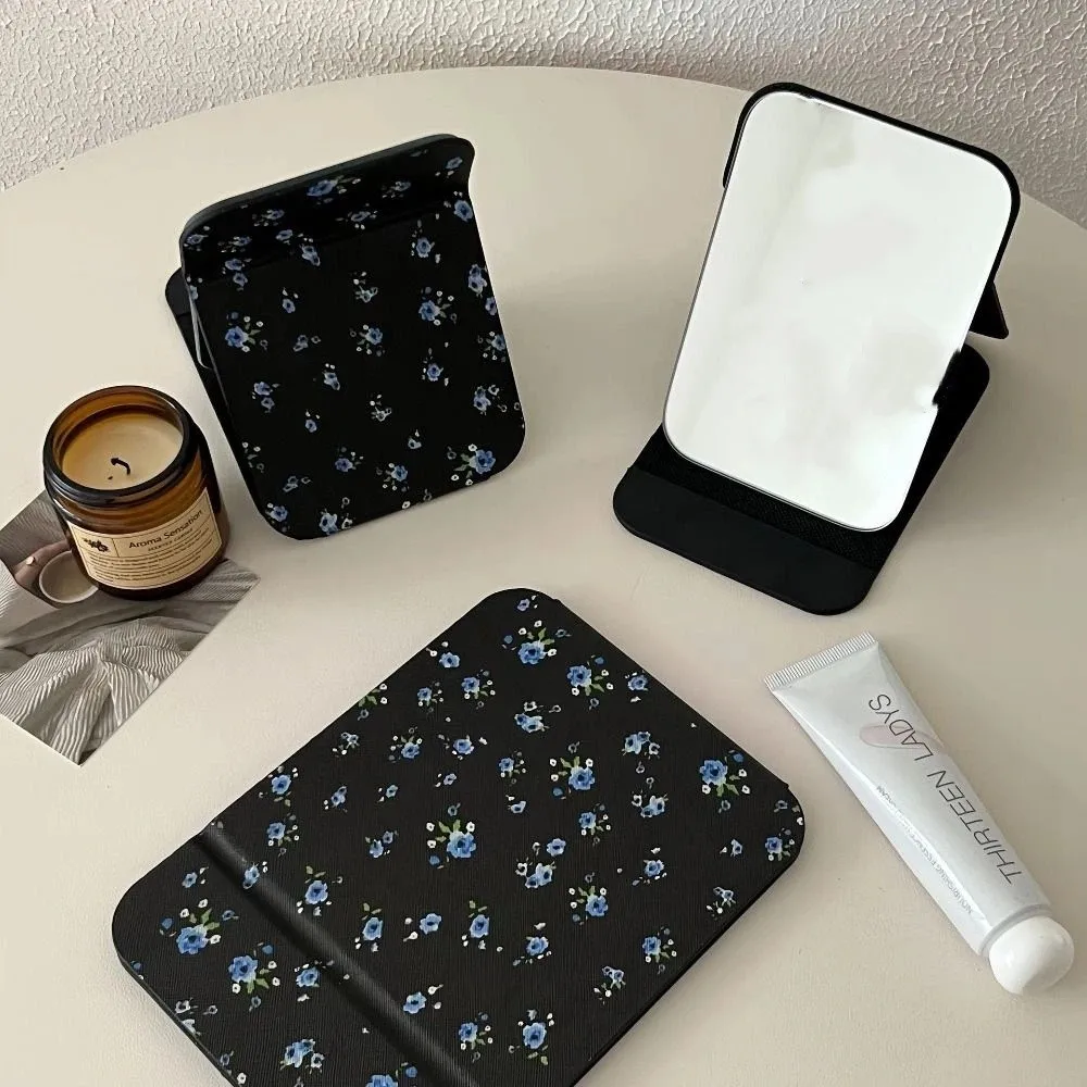 Pu Leather Desktop Stand Mirror Compact Cosmetic Mirror Flower Fold Makeup Mirror Delicate Light Weight Vanity Mirror Unisex
Pu Leather Desktop Stand Mirror Compact Cosmetic Mirror Flower Fold Makeup Mirror Delicate Light Weight Vanity Mirror Unisex