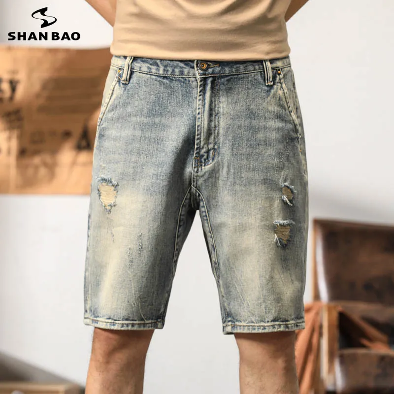 SHAN BAO 2026 Summer Brand Clothing Men's Straight Loose Distressed Mustache Effect Hole Denim Shorts Stylish retro shorts
SHAN BAO 2026 Summer Brand Clothing Men's Straight Loose Distressed Mustache Effect Hole Denim Shorts Stylish retro shorts