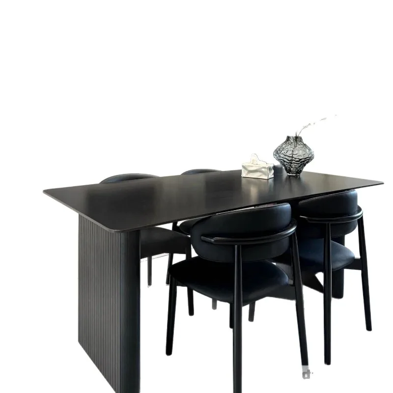 Modern light luxury black rock slab dining table and chair combination Italian home simplicity
Modern light luxury black rock slab dining table and chair combination Italian home simplicity
