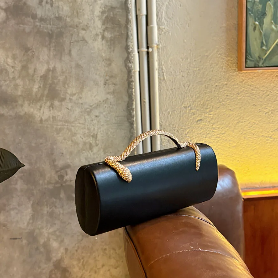 Premium black leather cylinder snake pattern woven handle handbag light luxury texture simple atmosphere dinner bag
Premium black leather cylinder snake pattern woven handle handbag light luxury texture simple atmosphere dinner bag