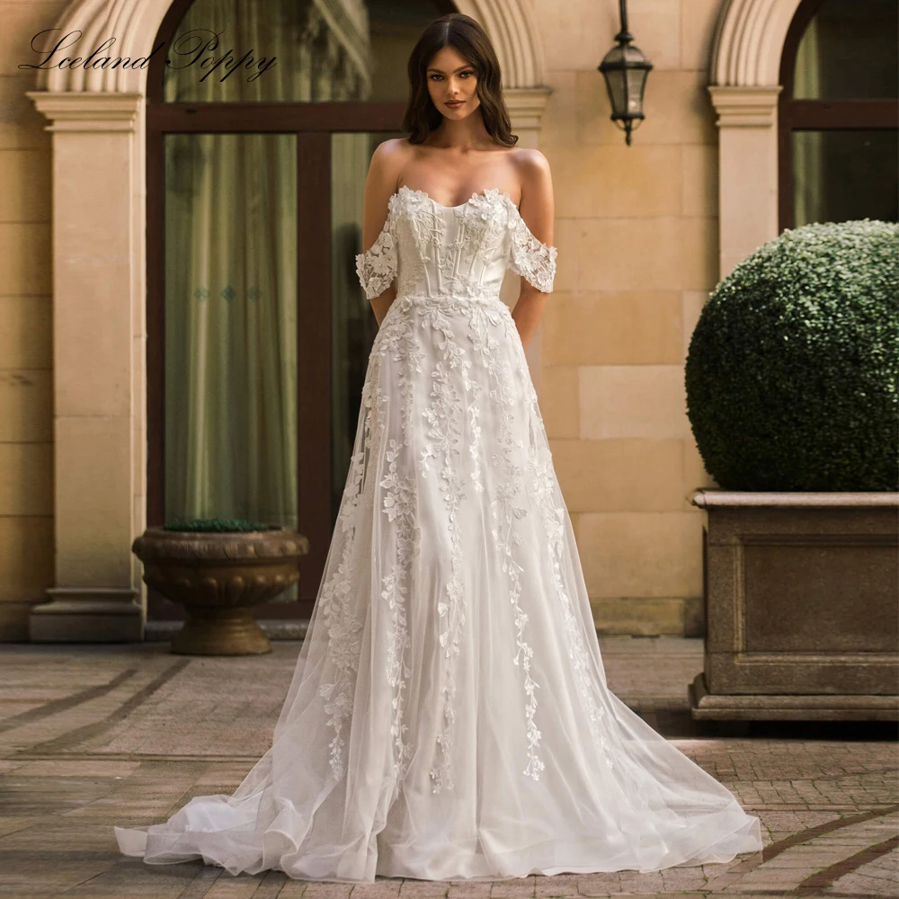 Lceland Poppy Customized A Line Lace Wedding Dresses Off the Shoulder Beaded Bridal Gowns with 3D Flowers
Lceland Poppy Customized A Line Lace Wedding Dresses Off the Shoulder Beaded Bridal Gowns with 3D Flowers