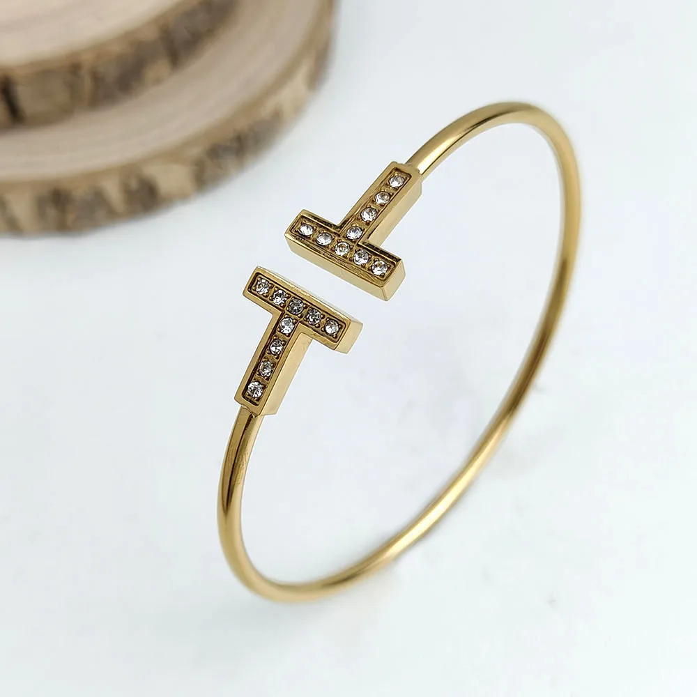 Fashion double T-shaped 18K gold-plated stainless steel open zircon bangle, light luxury, social, party, daily use,self-use,gift
Fashion double T-shaped 18K gold-plated stainless steel open zircon bangle, light luxury, social, party, daily use,self-use,gift