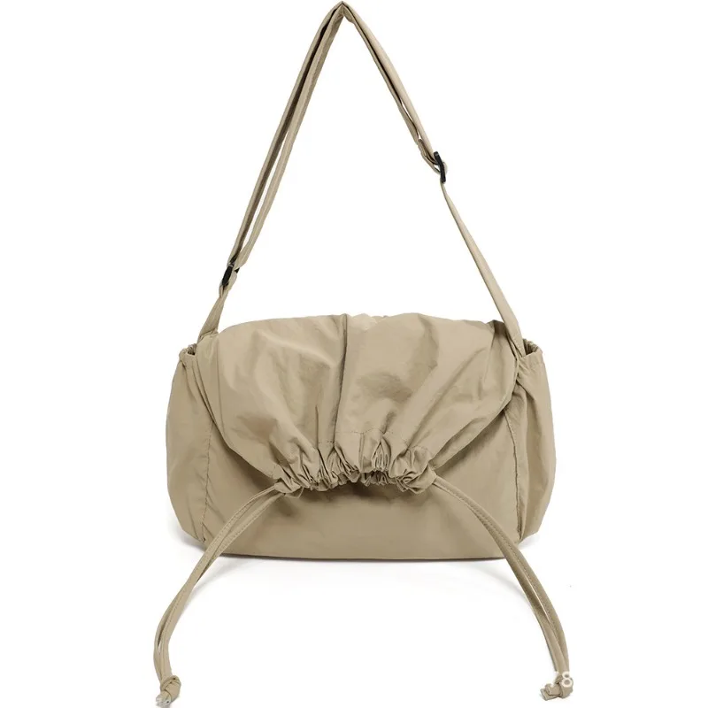 Large Capacity Nylon Fabric Crossbody Bag for Men and Women, Hong Kong Style Street Fashion Cool Drawstring Dumpling Bag
Large Capacity Nylon Fabric Crossbody Bag for Men and Women, Hong Kong Style Street Fashion Cool Drawstring Dumpling Bag