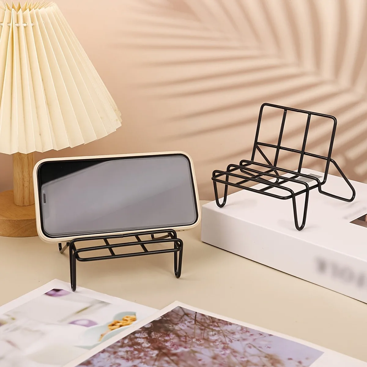 A Small Black Modern Minimalist Chair Phone Stand for The Desktop, Featuring a Metal Design for Tablets And Phones
A Small Black Modern Minimalist Chair Phone Stand for The Desktop, Featuring a Metal Design for Tablets And Phones