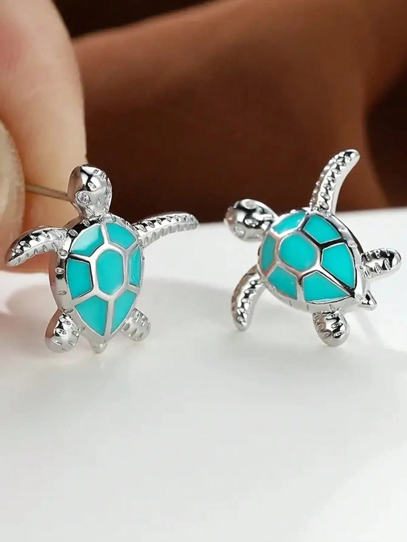 Tiny Sea Turtle Stud Earrings with Turquoise Enamel Shell in Silver-Tone Metal
Tiny Sea Turtle Stud Earrings with Turquoise Enamel Shell in Silver-Tone Metal