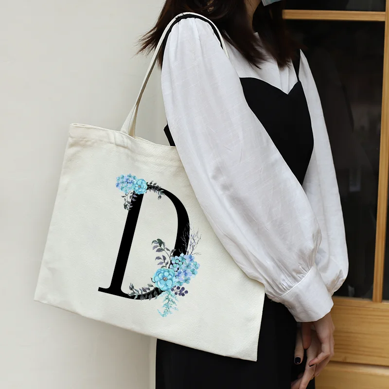 Casual Shopping Bag Flower 26 Letters Shoulder Canvas Bag Horizontal Version With Zipper Large Capacity All-match Handbag Summer
Casual Shopping Bag Flower 26 Letters Shoulder Canvas Bag Horizontal Version With Zipper Large Capacity All-match Handbag Summer