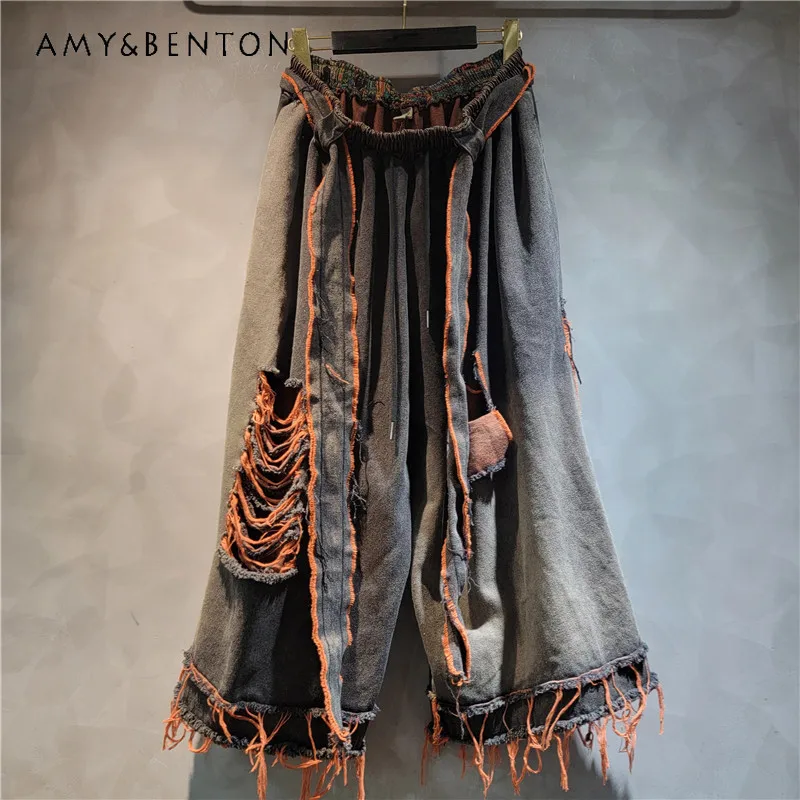 Distressed Raw Hem Spliced Denim Trousers Elastic Waist Ripped Loose Wide Leg Floor Length Jeans Cool Versatile Casual Pants
Distressed Raw Hem Spliced Denim Trousers Elastic Waist Ripped Loose Wide Leg Floor Length Jeans Cool Versatile Casual Pants