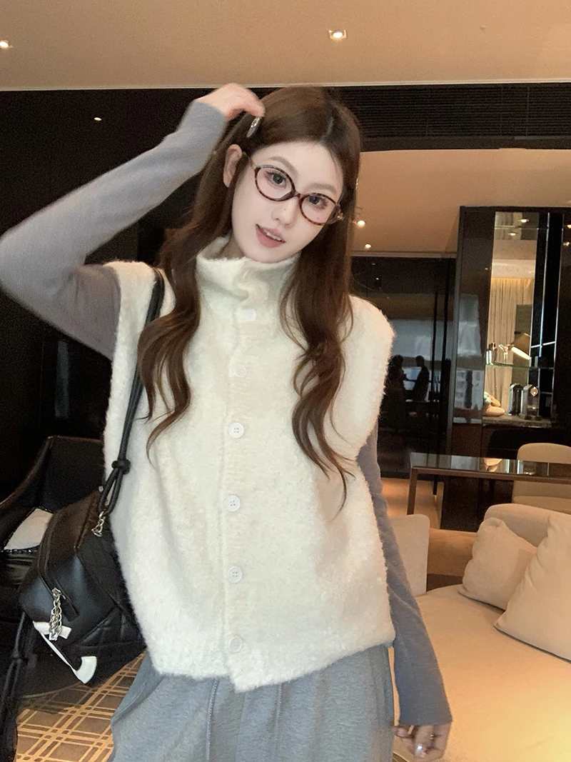 Корейский вязаный шерстяной жилет с высоким воротником для женщин, весенне-осенний, маленький размер, верхняя одежда, теплый кардиган без рукавов
Корейский вязаный шерстяной жилет с высоким воротником для женщин, весенне-осенний, маленький размер, верхняя одежда, теплый кардиган без рукавов