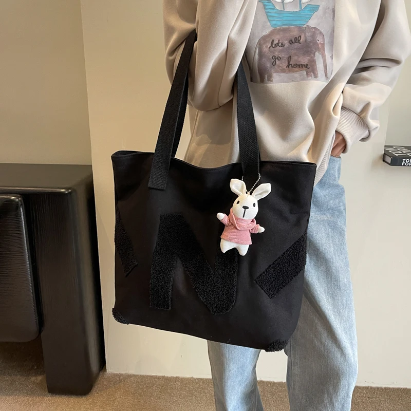 Simple Fashion Versatile Women's Letter Printed Canvas Single Shoulder Storage Bag Leisure Large Capacity Commuting Tote Bags
Simple Fashion Versatile Women's Letter Printed Canvas Single Shoulder Storage Bag Leisure Large Capacity Commuting Tote Bags