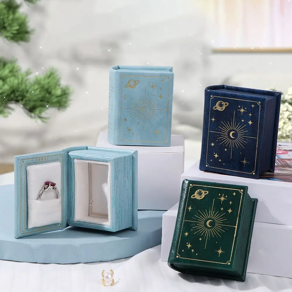 Small Creative Book Shape Ring Box Flip Lid Magnetic Engagement Ring Case Storage Box Velvet Jewelry Packaging Gift Box
Small Creative Book Shape Ring Box Flip Lid Magnetic Engagement Ring Case Storage Box Velvet Jewelry Packaging Gift Box