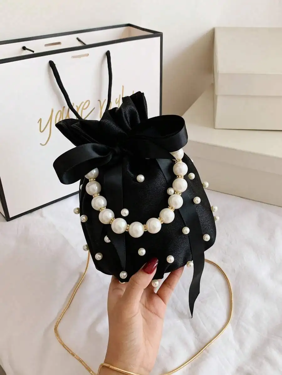 Black Satin Drawstring Purse Adorned With Pearl Beads And Silk Bow For Women
Black Satin Drawstring Purse Adorned With Pearl Beads And Silk Bow For Women