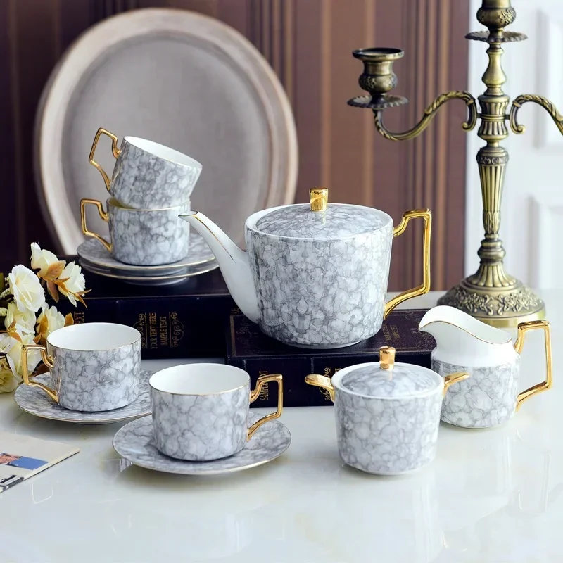 Nordic Ceramic Golden Tea Set for 6 Persons Porcelain Marble Coffee Cup Saucer Teapot Sugar Bowl Milk Pot
Nordic Ceramic Golden Tea Set for 6 Persons Porcelain Marble Coffee Cup Saucer Teapot Sugar Bowl Milk Pot