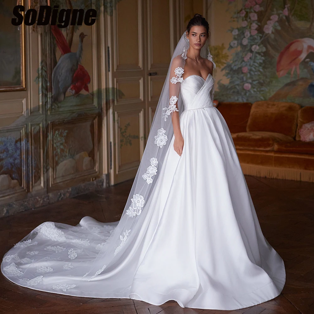 SoDigne A-line Satin Wedding Dresses Sleeveless Sweetheart Pearls Bridal Dress 2026 Bride Gown vestidos de novia Customized
SoDigne A-line Satin Wedding Dresses Sleeveless Sweetheart Pearls Bridal Dress 2026 Bride Gown vestidos de novia Customized