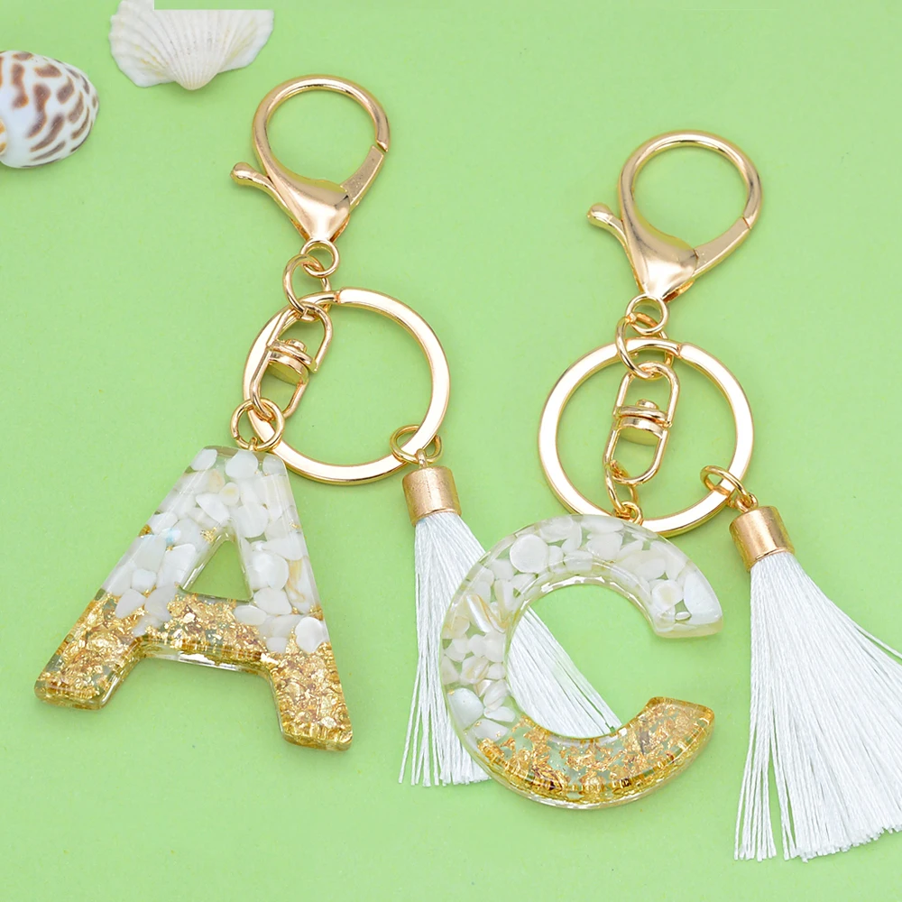 White Tassel Key Ring Gradient Gold Foil Filled Resin 26 Letters Keychains Women Girl Handbag Ornaments Graduation Gift
White Tassel Key Ring Gradient Gold Foil Filled Resin 26 Letters Keychains Women Girl Handbag Ornaments Graduation Gift