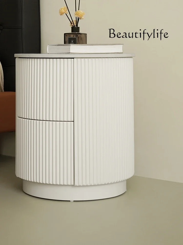 Simple cream wind round bedside table rock slab bedside locker bedroom drawer locker
Simple cream wind round bedside table rock slab bedside locker bedroom drawer locker