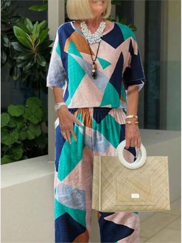 Повседневные свободные женские костюмы с круглым вырезом, топ с короткими рукавами и брюки, комплект из двух предметов для женщин, 2024, летние модные комплекты с принтом, женские комплекты
Повседневные свободные женские костюмы с круглым вырезом, топ с короткими рукавами и брюки, комплект из двух предметов для женщин, 2024, летние модные комплекты с принтом, женские комплекты