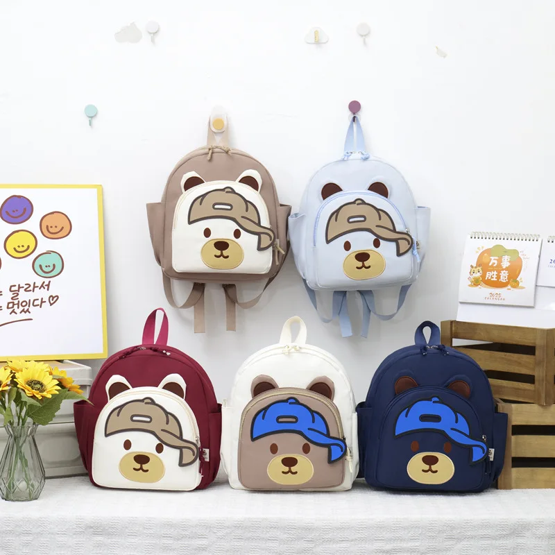 Легкий нейлоновый школьный рюкзак для студентов, с милым медведем, мультяшный, водонепроницаемый, детский рюкзак с контрастными цветами.
Легкий нейлоновый школьный рюкзак для студентов, с милым медведем, мультяшный, водонепроницаемый, детский рюкзак с контрастными цветами.