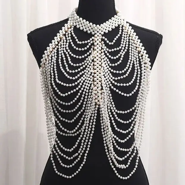 The latest Chinese design hot body chain The little pearl vest girl with the pop halter
The latest Chinese design hot body chain The little pearl vest girl with the pop halter