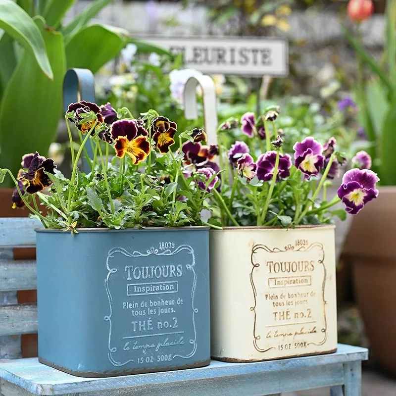 Vintage French Style Metal Hanging Planter, Wall Mount Flower Pot with Hook, Square Design, 11.5x11.5x10.5 inches, Blue and Whit
Vintage French Style Metal Hanging Planter, Wall Mount Flower Pot with Hook, Square Design, 11.5x11.5x10.5 inches, Blue and Whit