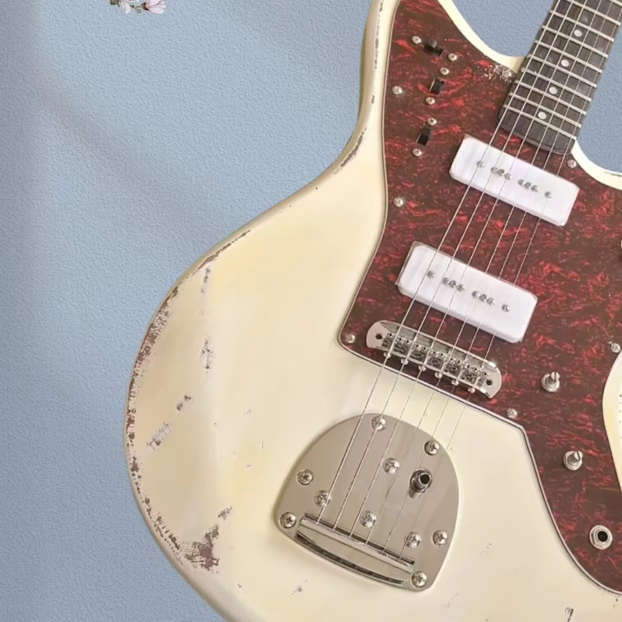 Vintage antique electric guitar, yellow 6-string, tremolo bridge, chrome hardware
Vintage antique electric guitar, yellow 6-string, tremolo bridge, chrome hardware