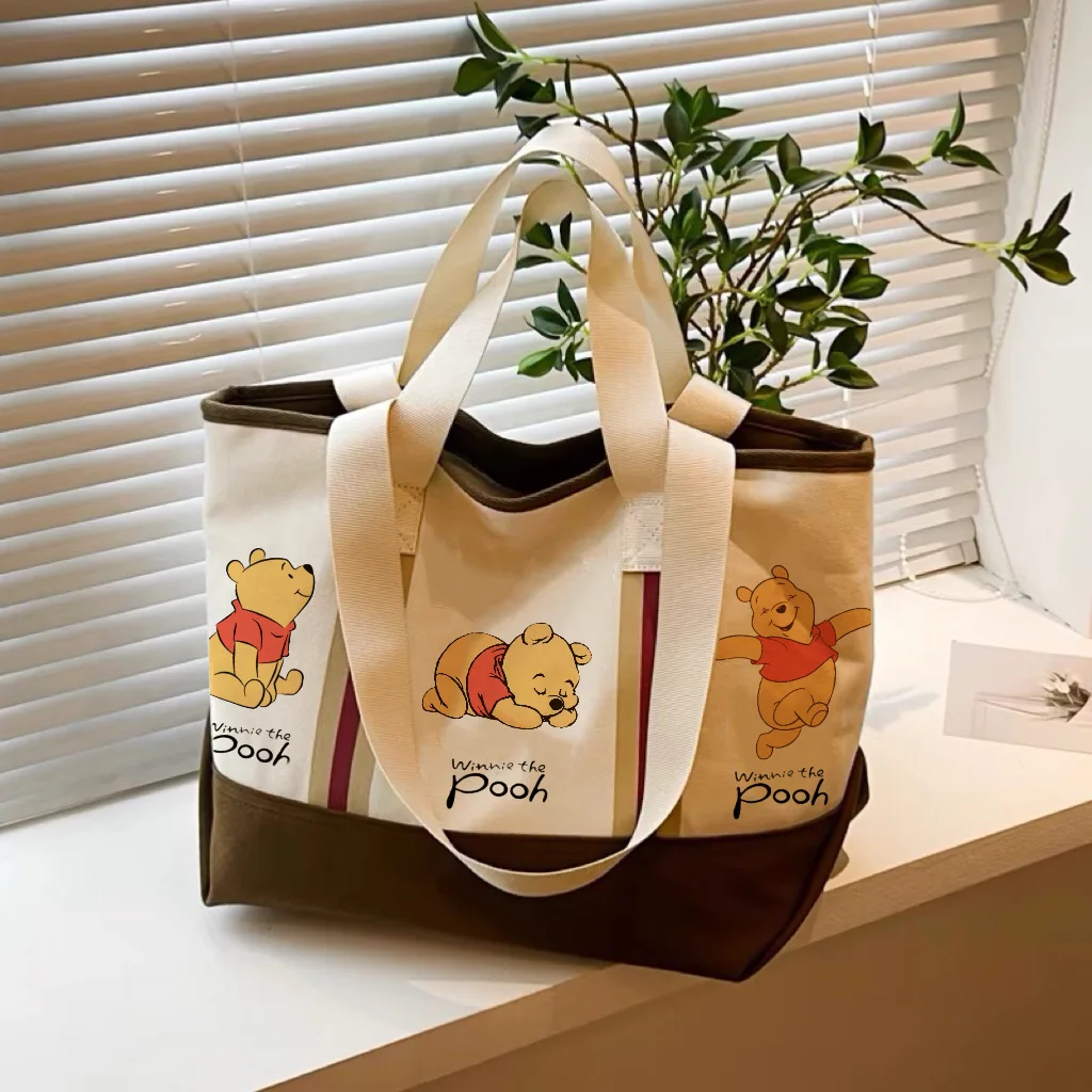 Miniso retro cartoon Winnie Bear canvas bag women, commuting tote bag, versatile large capacity one-shoulder tote bag
Miniso retro cartoon Winnie Bear canvas bag women, commuting tote bag, versatile large capacity one-shoulder tote bag