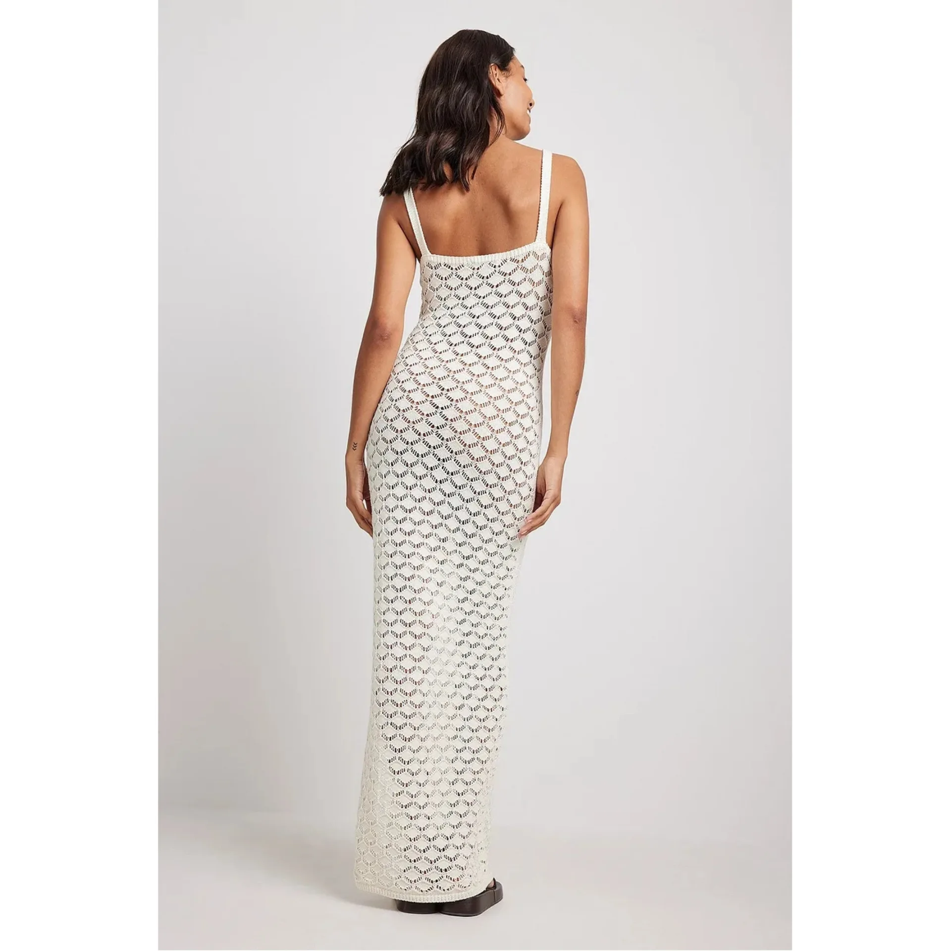 2023 Summer New Vacation Style Long Women's Sling Side Split Open Back Hollow Pattern Knitted Skirt
2023 Summer New Vacation Style Long Women's Sling Side Split Open Back Hollow Pattern Knitted Skirt