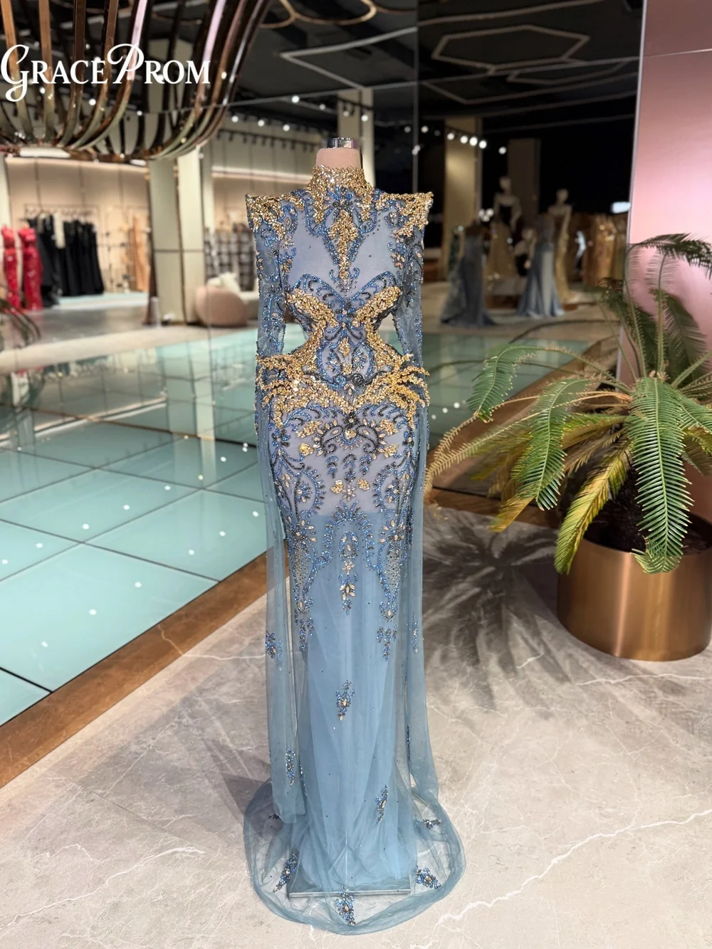 Exquisite Dusty Blue Sheer Tulle Evening Gown 2026 Majestic Gold Blue Crystal Beaded Party Dress For Wedding Guests فساتين سهرة
Exquisite Dusty Blue Sheer Tulle Evening Gown 2026 Majestic Gold Blue Crystal Beaded Party Dress For Wedding Guests فساتين سهرة