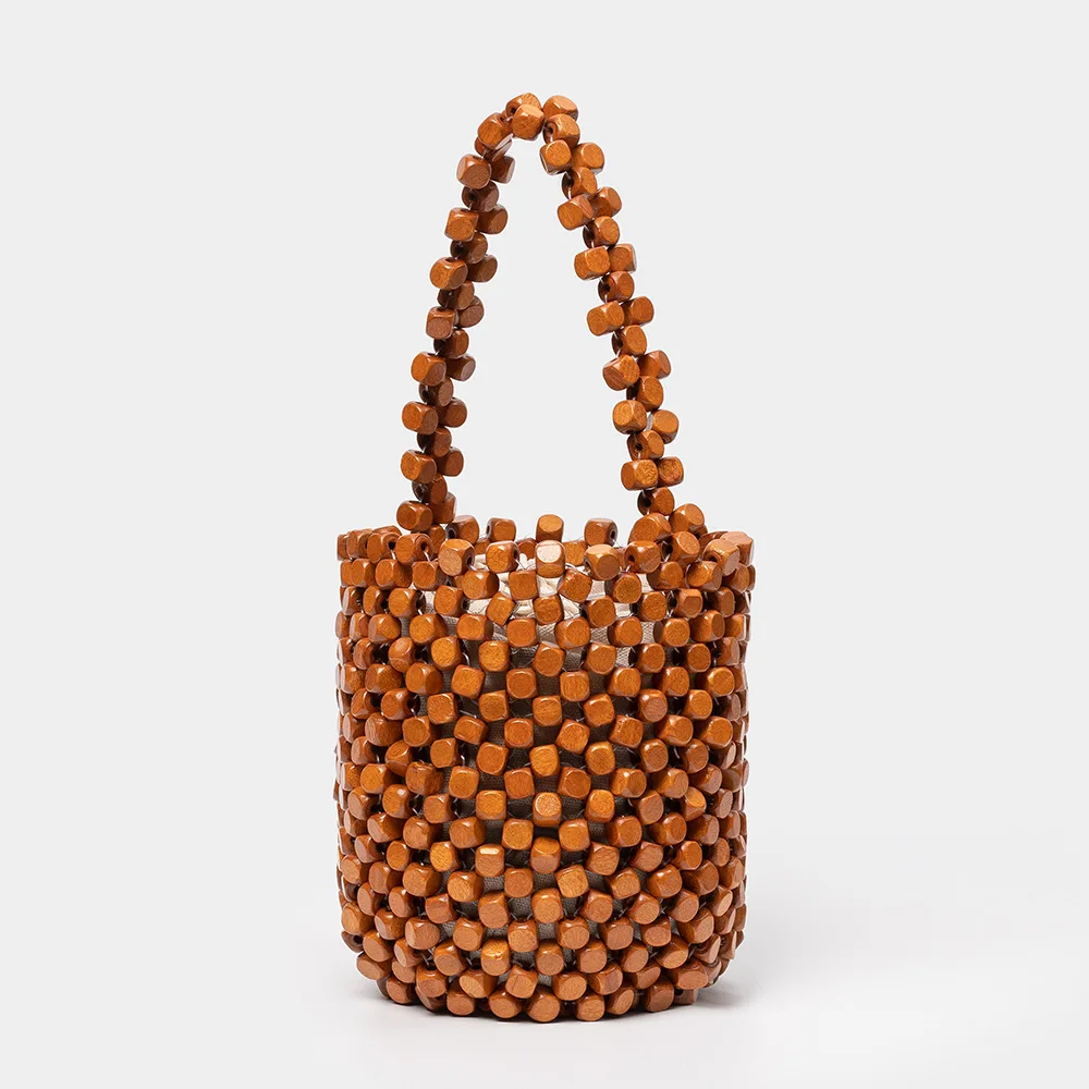Handmade Woven Bucket Bag Exquisite Design Hollow-out Wooden Bead Small Bag Female Handmade Beaded Handbag
Handmade Woven Bucket Bag Exquisite Design Hollow-out Wooden Bead Small Bag Female Handmade Beaded Handbag