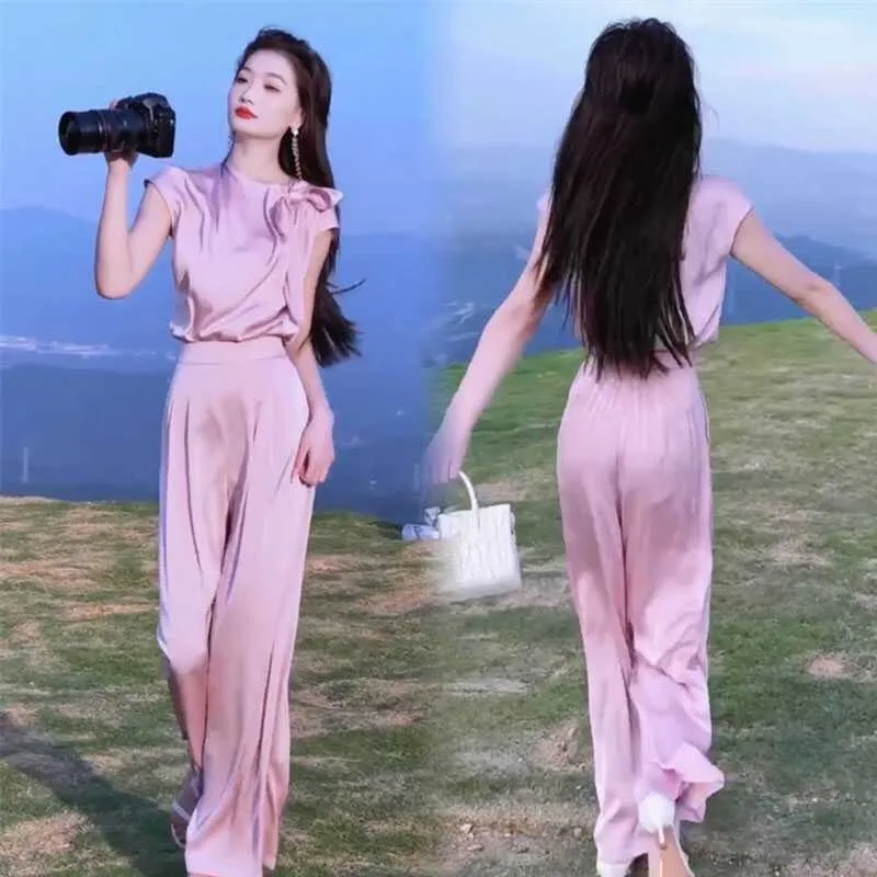 Новая мода Летний женский комплект из двух предметов Элегантная блузка с круглым вырезом и коротким рукавом на шнуровке с бантом + широкие брюки Однотонный повседневный костюм
Новая мода Летний женский комплект из двух предметов Элегантная блузка с круглым вырезом и коротким рукавом на шнуровке с бантом + широкие брюки Однотонный повседневный костюм