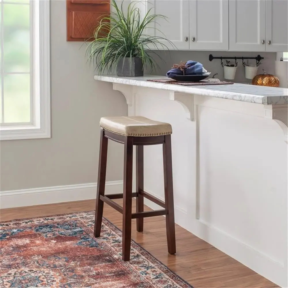 32" Transitional Wood Bar Stool, Beige aux Leather Upholstery, k Brown e, Antiqued Brass NailTrim, 275 lb Weight Limit, Bar Heig
32" Transitional Wood Bar Stool, Beige aux Leather Upholstery, k Brown e, Antiqued Brass NailTrim, 275 lb Weight Limit, Bar Heig