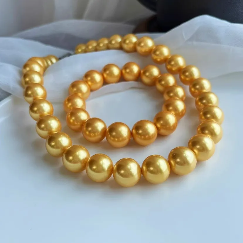 14Mm gold large shell pearl particle bead necklace bracelet set is simple fashionable versatile
14Mm gold large shell pearl particle bead necklace bracelet set is simple fashionable versatile