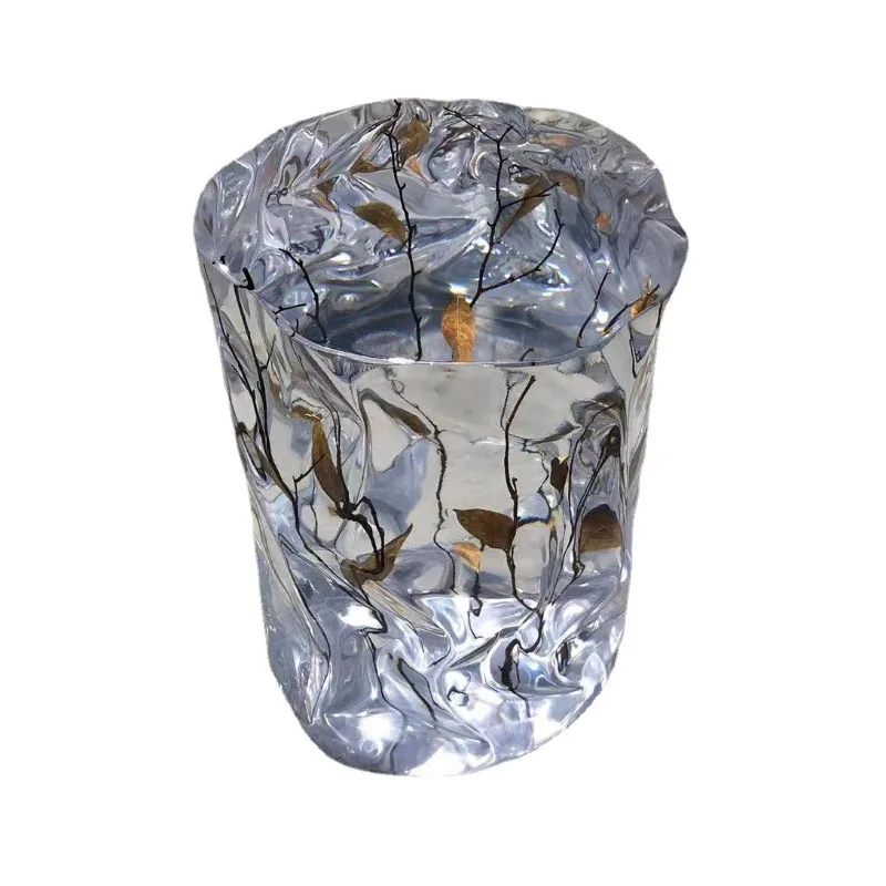 Modern light luxury soft decoration design exhibition hall living room low stool epoxy resin special-shaped crystal pier plant
Modern light luxury soft decoration design exhibition hall living room low stool epoxy resin special-shaped crystal pier plant