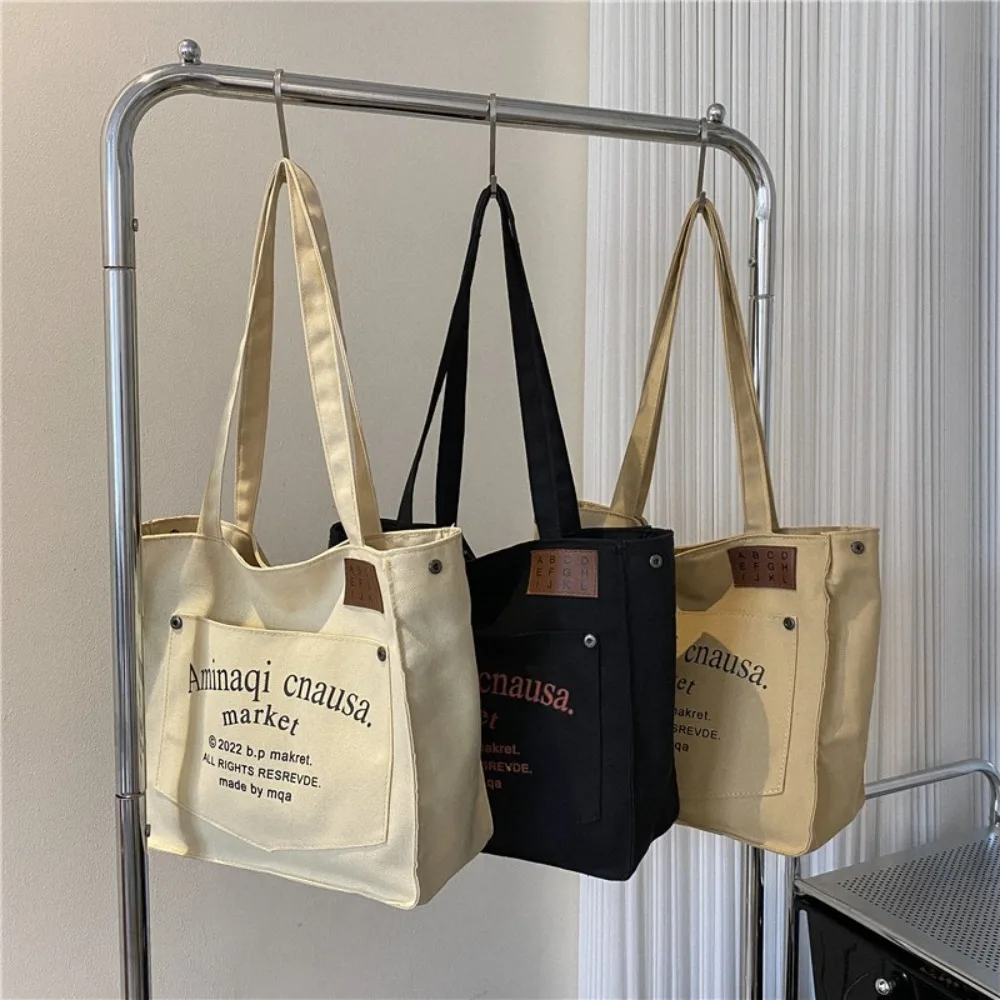 Trendy Solid Color Simple Shoulder Bag Letter Print Square Shape Canvas Bag Tote Bag
Trendy Solid Color Simple Shoulder Bag Letter Print Square Shape Canvas Bag Tote Bag